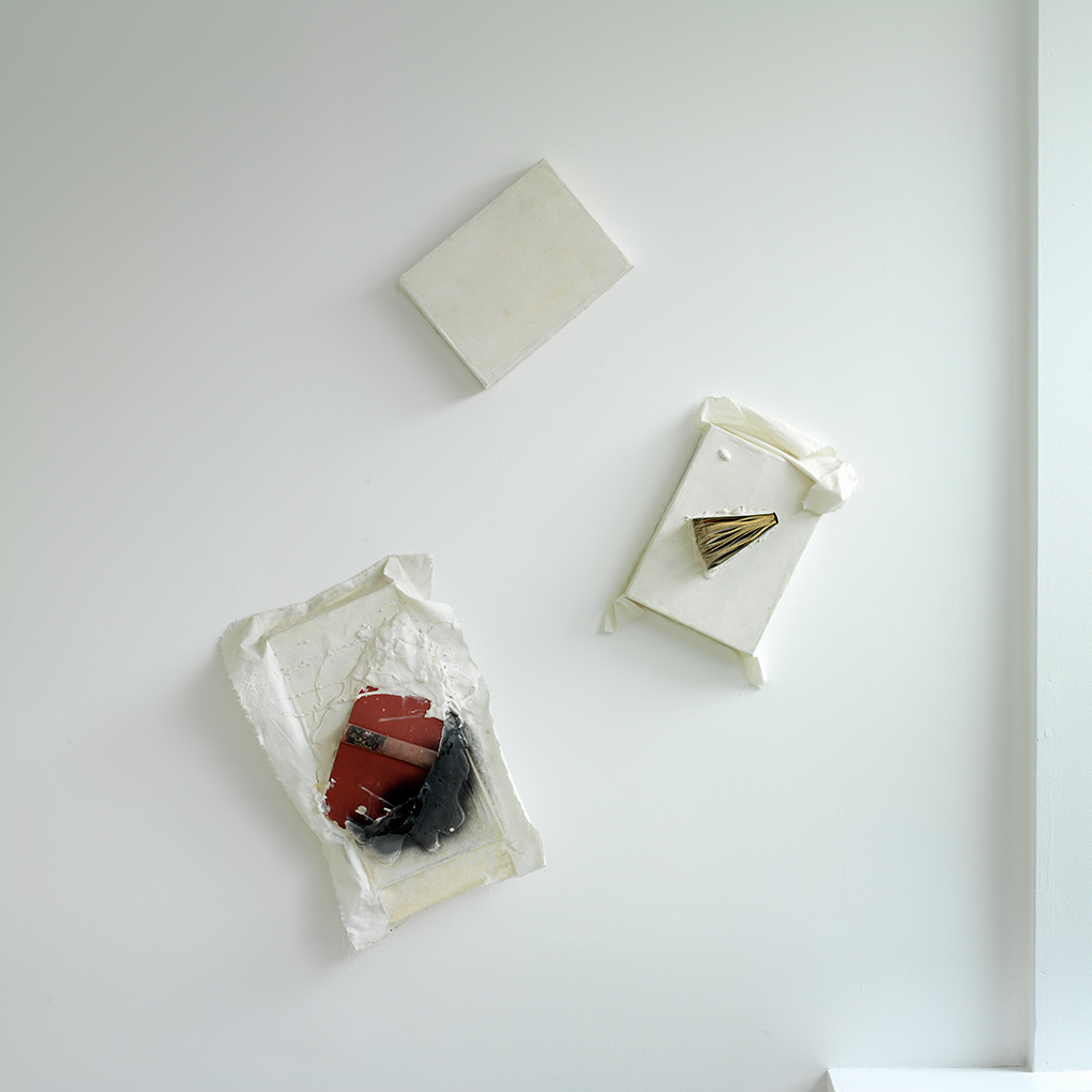 Book Relief Triad (2003/1959) Ink, plaster, books and white duck on wooden boxes. Photo: Ken Adlard (FTHo open by appointment  6)